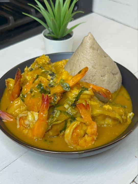Fisherman soup with seafood and fufu